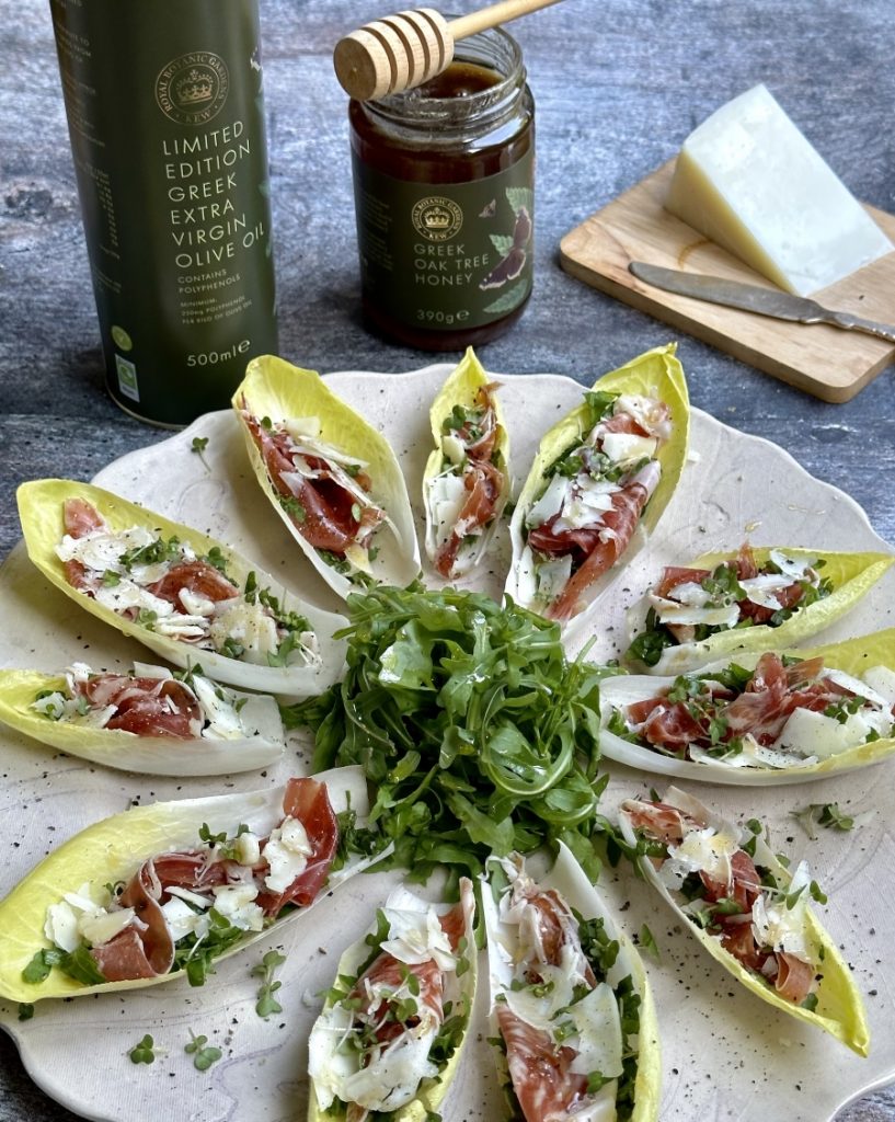 Odysea chicory canapes with bresaola graviera and raw oak honey recipe