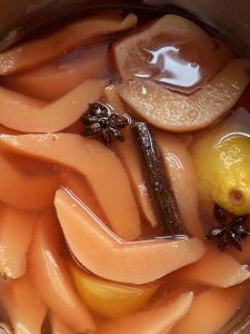 Quinces in syrup with spices to bake a cake with yoghurt and quince
